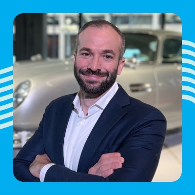 Photo of Jeff Rogg standing in front of a car